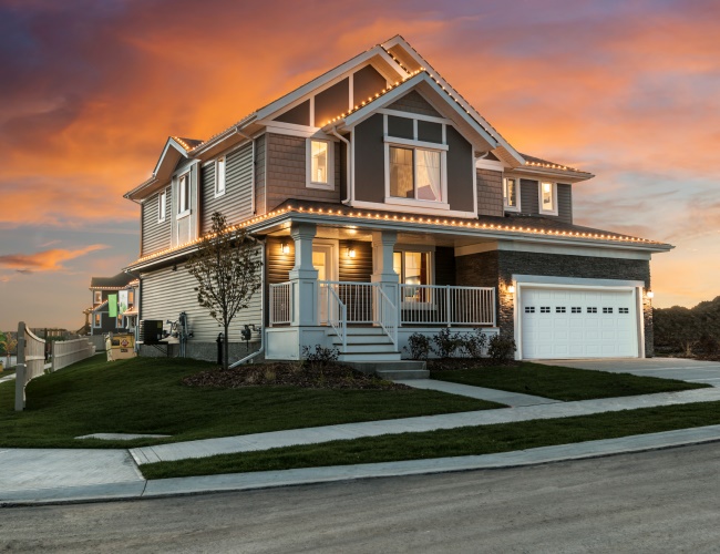 Timber Ridge rendering (house) on corner with sunset background.